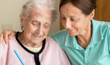 elderly woman with caregiver